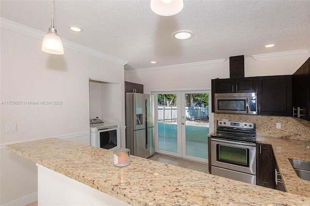 kitchen featuring decorative light fixtures, kitchen peninsula, stainless steel appliances, ornamental molding, and light tile patterned floors