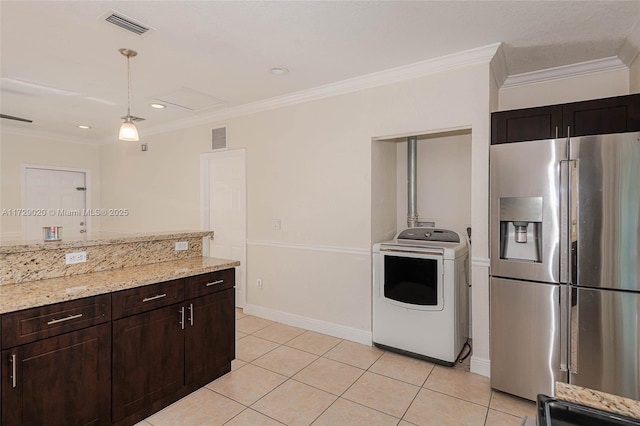 kitchen with washer / dryer, dark brown cabinets, crown molding, light tile patterned floors, and stainless steel fridge