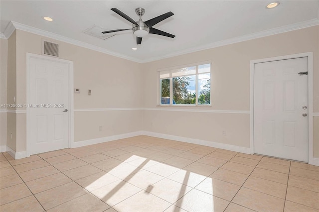 tiled spare room with ceiling fan and crown molding