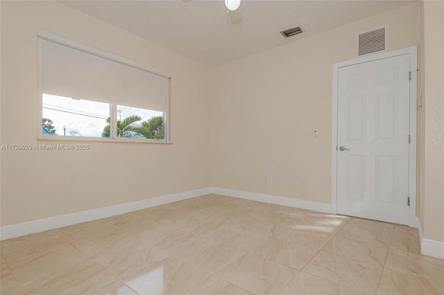 unfurnished room featuring ceiling fan