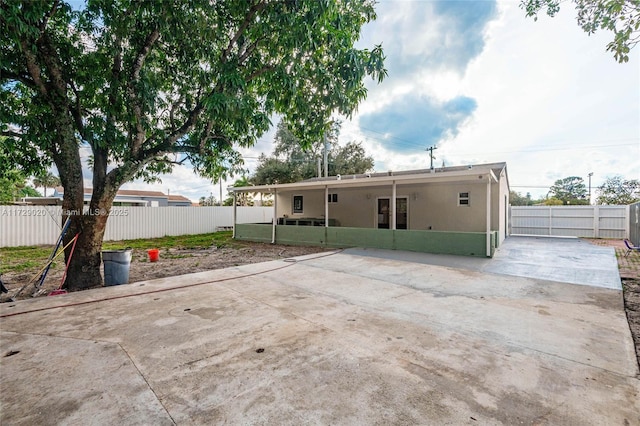 rear view of house with a carport