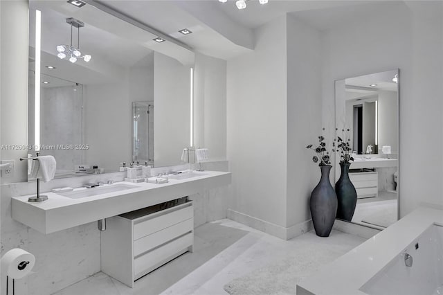 bathroom with walk in shower and vanity