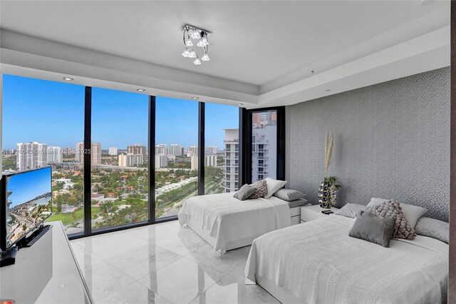 bedroom with multiple windows and expansive windows