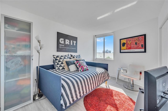 bedroom with hardwood / wood-style floors