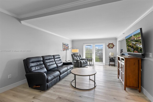 living room featuring light hardwood / wood-style flooring and crown molding