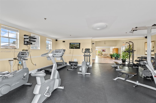 gym featuring baseboards and ornamental molding