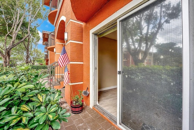 property entrance with a balcony