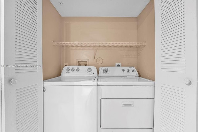 clothes washing area featuring washing machine and clothes dryer