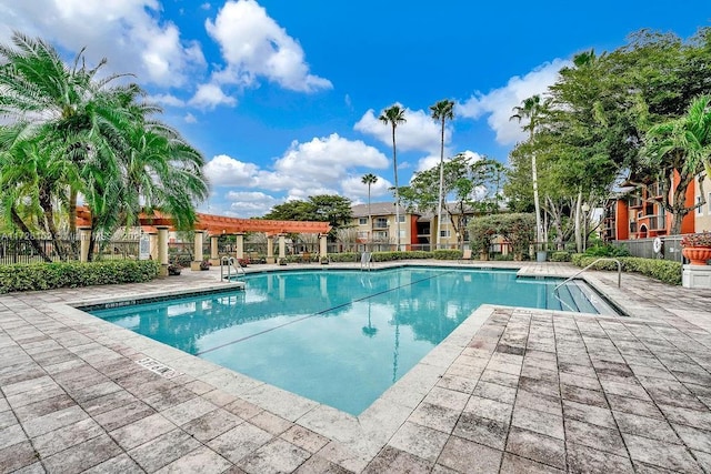 view of pool with a patio area and a pergola