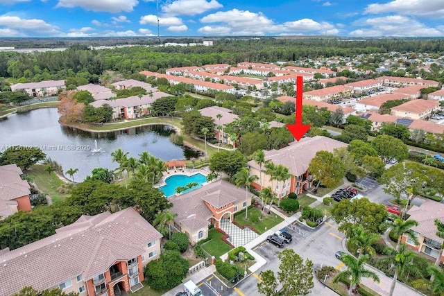 birds eye view of property with a water view