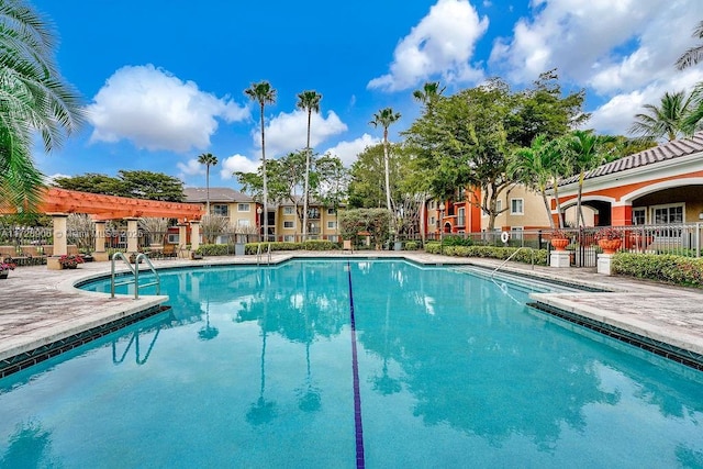 view of pool with a pergola and a patio area