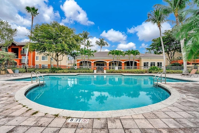 view of swimming pool featuring a patio area