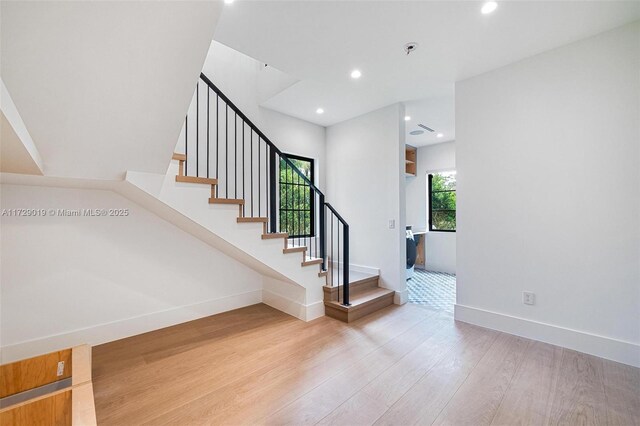 11001 SW 74th Ave, Pinecrest, FL 33156 - stairway with wood finished floors, baseboards, and recessed lighting