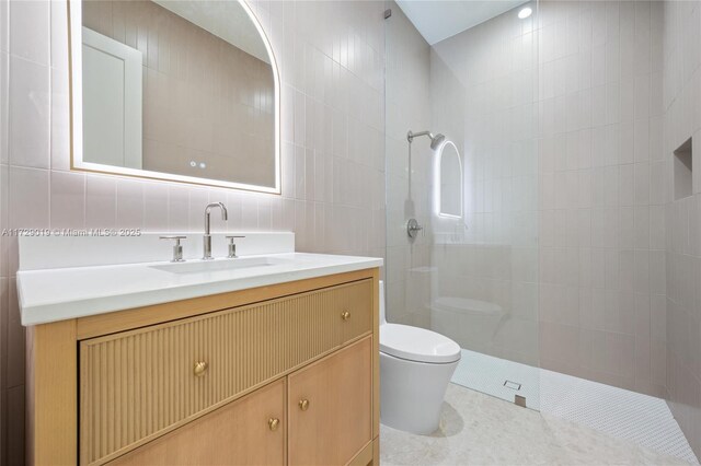 11001 SW 74th Ave, Pinecrest, FL 33156 - bathroom featuring toilet, tile walls, a walk in shower, vanity, and tile patterned floors