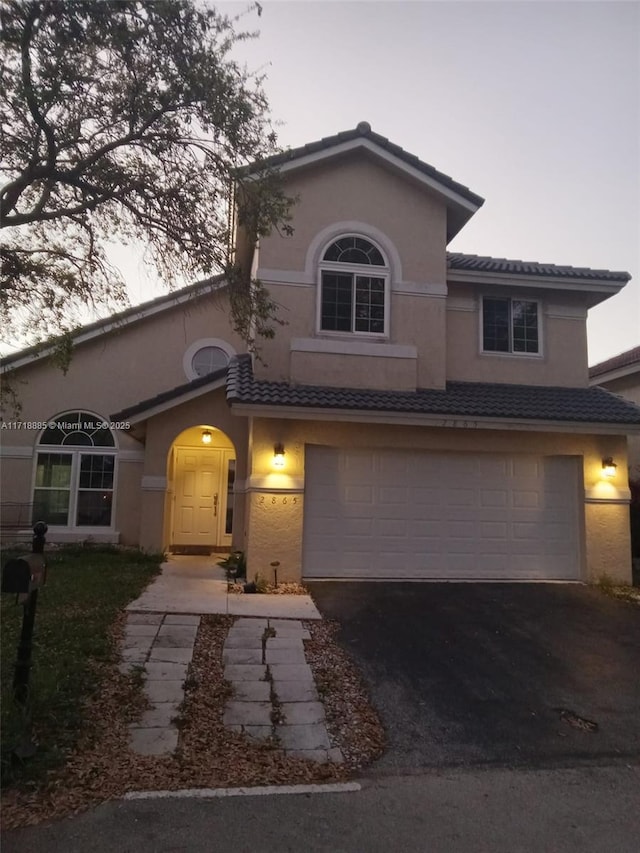 view of front of property featuring a garage