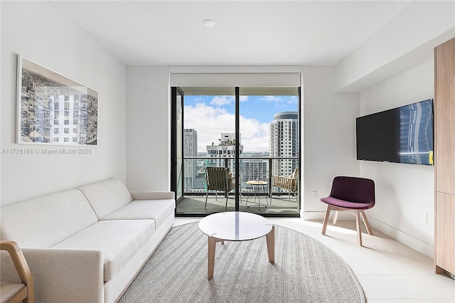 living room featuring a wall of windows