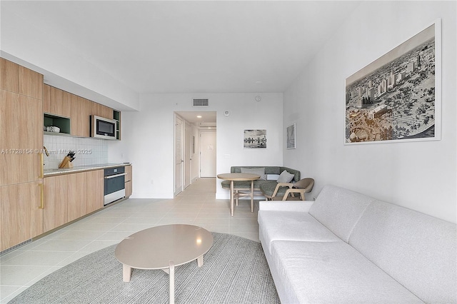 living room with light tile patterned floors