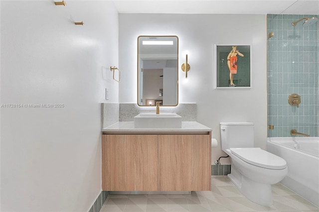 full bathroom with vanity, toilet, and tiled shower / bath