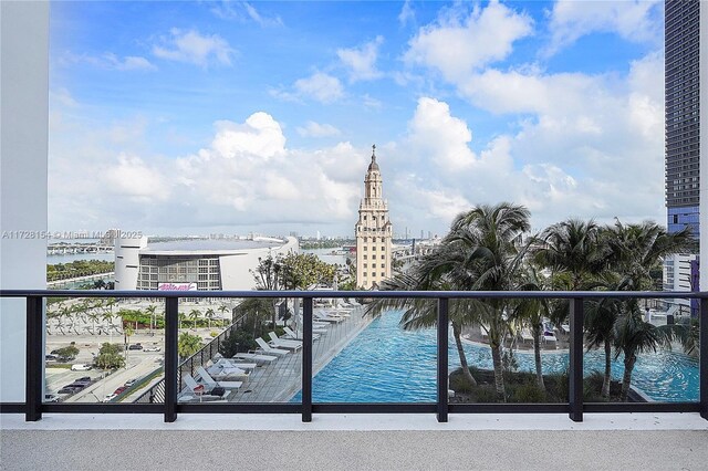 balcony featuring a water view