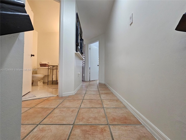 hallway featuring light tile patterned flooring