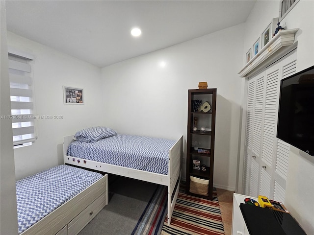 carpeted bedroom featuring a closet