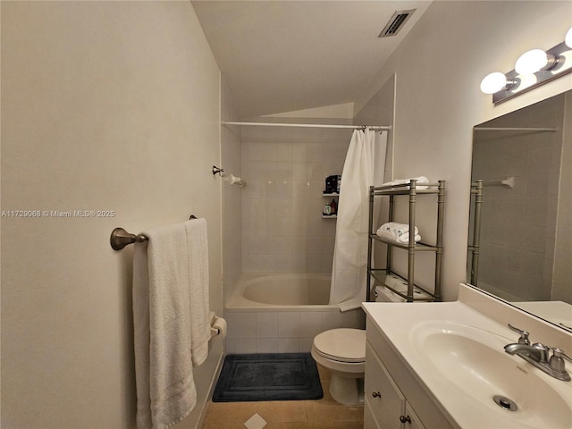 full bathroom with lofted ceiling, vanity, tile patterned floors, toilet, and shower / bath combo with shower curtain