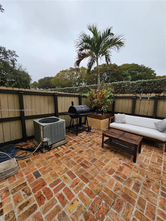 view of patio featuring grilling area, outdoor lounge area, and central AC unit