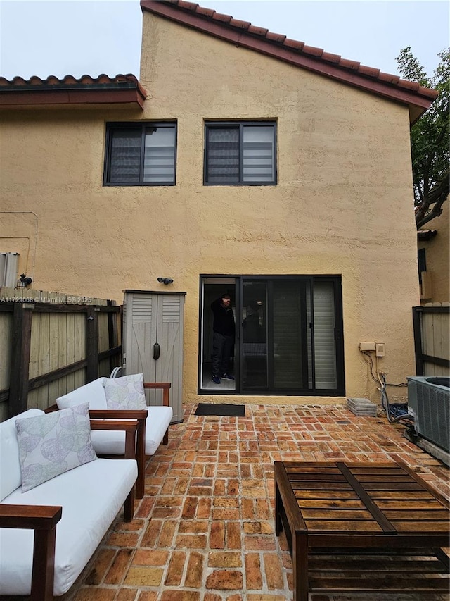 back of house featuring a patio and central AC unit