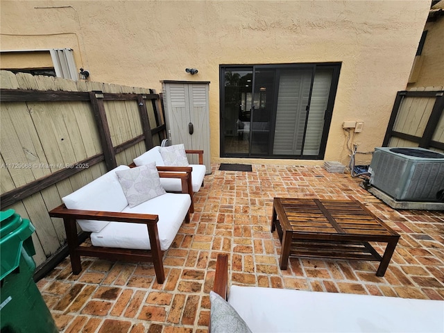 view of patio / terrace with central AC unit