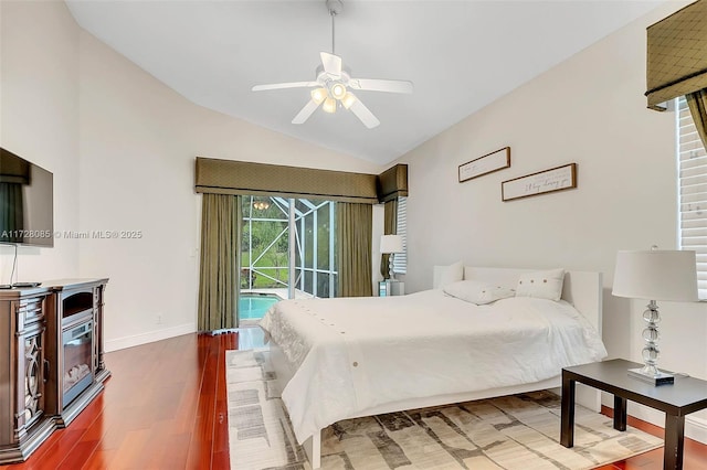 bedroom featuring hardwood / wood-style flooring, ceiling fan, lofted ceiling, and access to outside