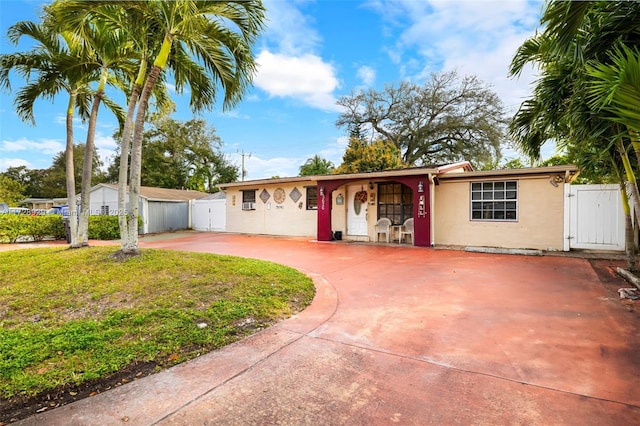 ranch-style home with a front yard