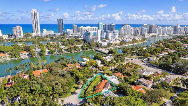 drone / aerial view featuring a water view and a city view