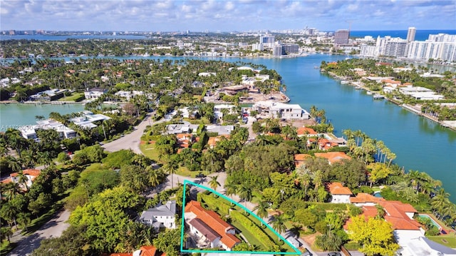 birds eye view of property featuring a water view, a city view, and a residential view