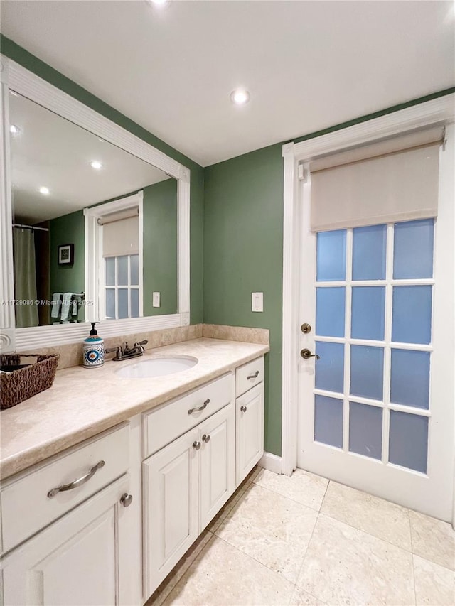 bathroom with vanity and tile patterned floors