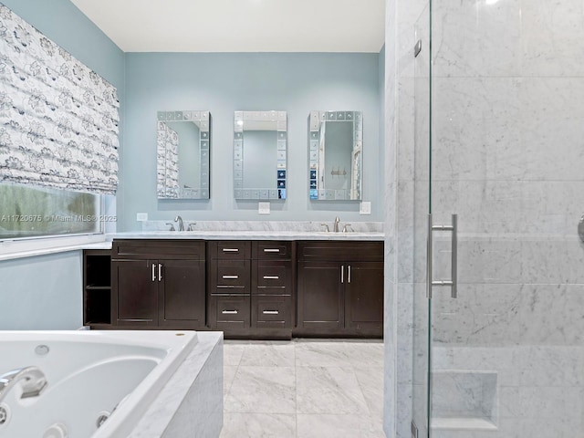 full bathroom featuring a whirlpool tub, a stall shower, double vanity, and a sink