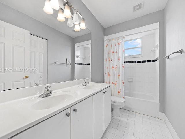 full bath with double vanity, tile patterned flooring, a sink, and visible vents