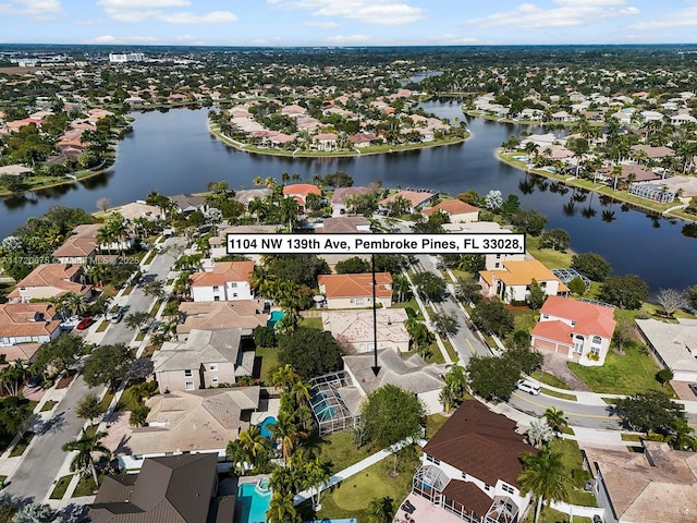 aerial view featuring a residential view and a water view