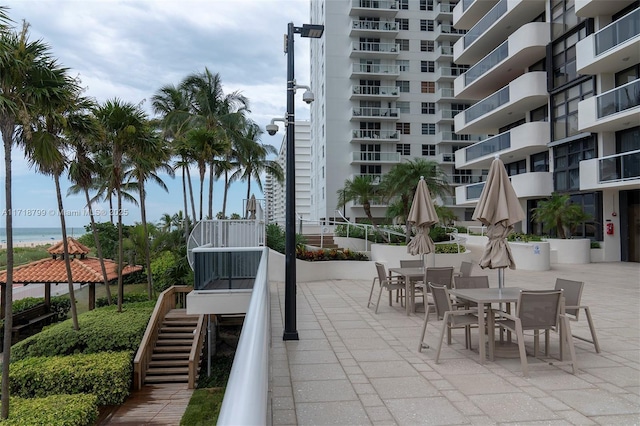 view of patio with a water view