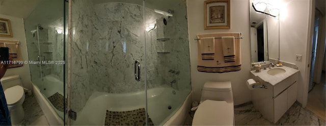 bathroom featuring toilet, vanity, and walk in shower