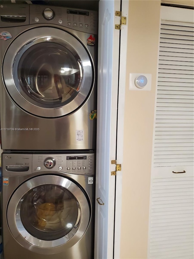 clothes washing area with stacked washer / drying machine