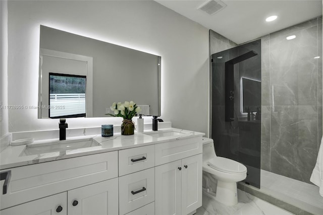 bathroom featuring toilet, vanity, and an enclosed shower