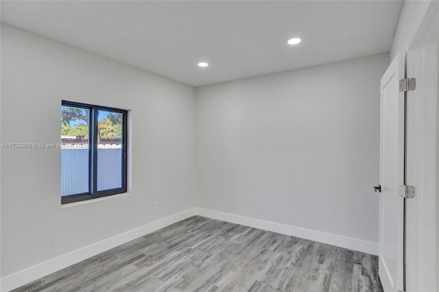 unfurnished room with light hardwood / wood-style flooring