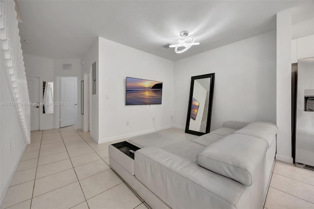 living room with light tile patterned flooring