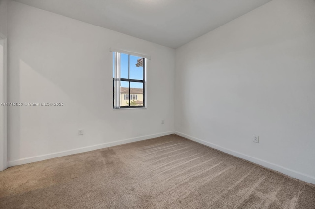 unfurnished room featuring carpet