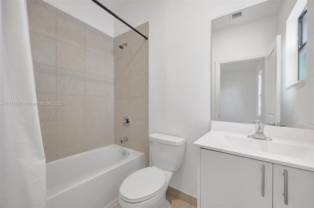 full bathroom featuring toilet, shower / bathtub combination with curtain, and vanity