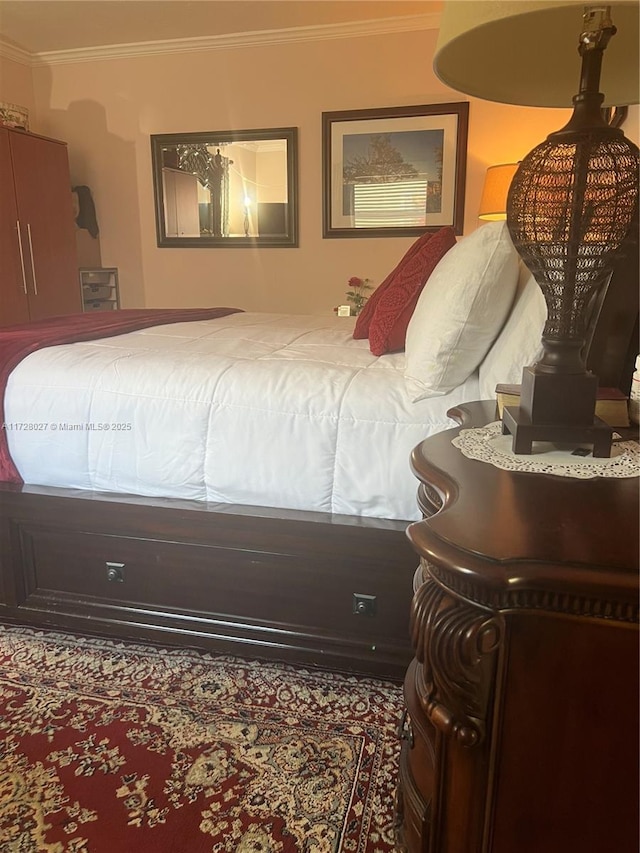 bedroom with ornamental molding