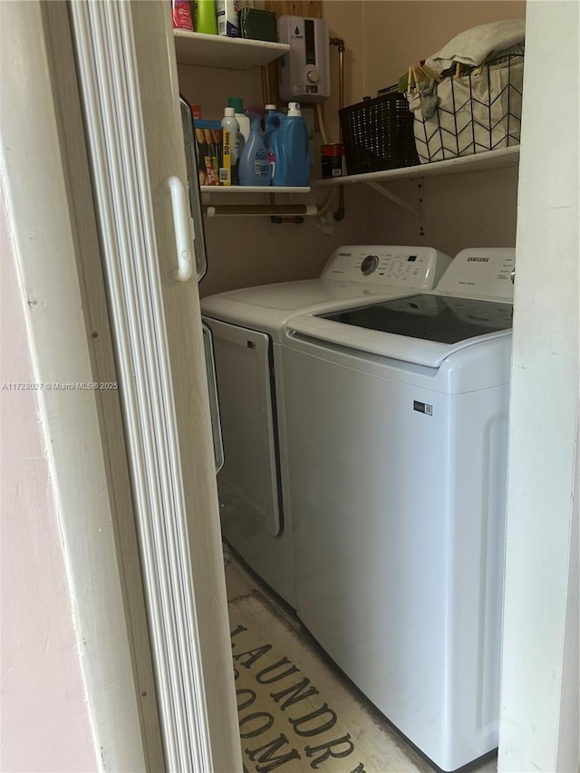 laundry room with independent washer and dryer