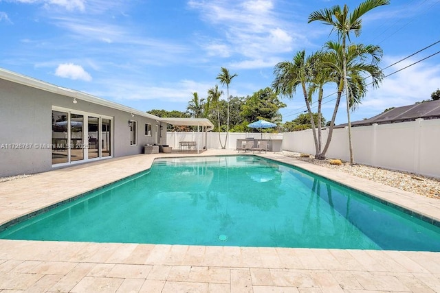 view of swimming pool featuring a patio area