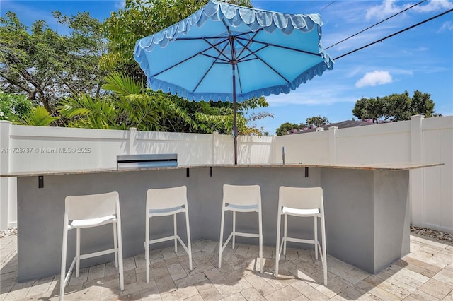 view of patio / terrace featuring exterior bar