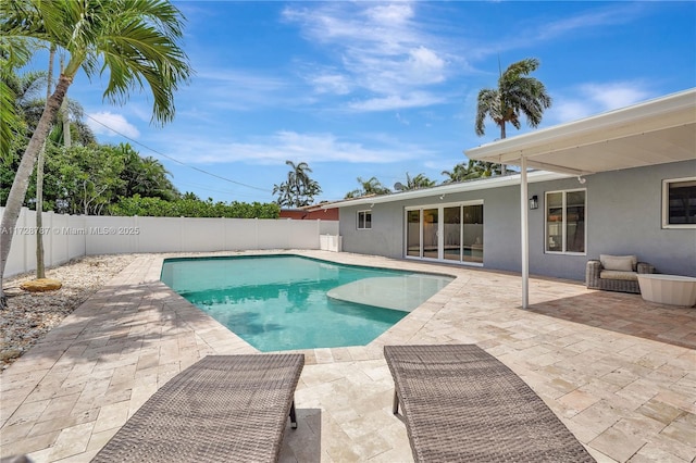 view of swimming pool with a patio